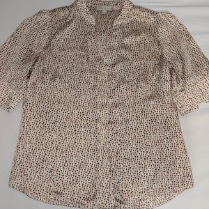 This a short sleeve button down blouse.